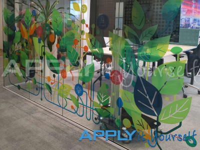 transparent window film, office, cut-to-shape, bespoke design, trees, leaves, colourful, company design