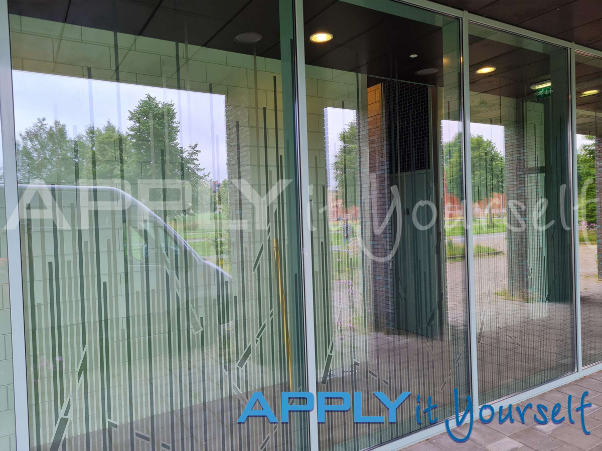 transparent window film, custom line design, reeds, design across multiple windows, apartment building, outside view