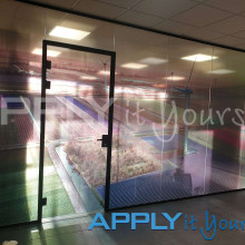 transparent window film, large photo, photo divided across multiple windows, office glass wall, indoor, front